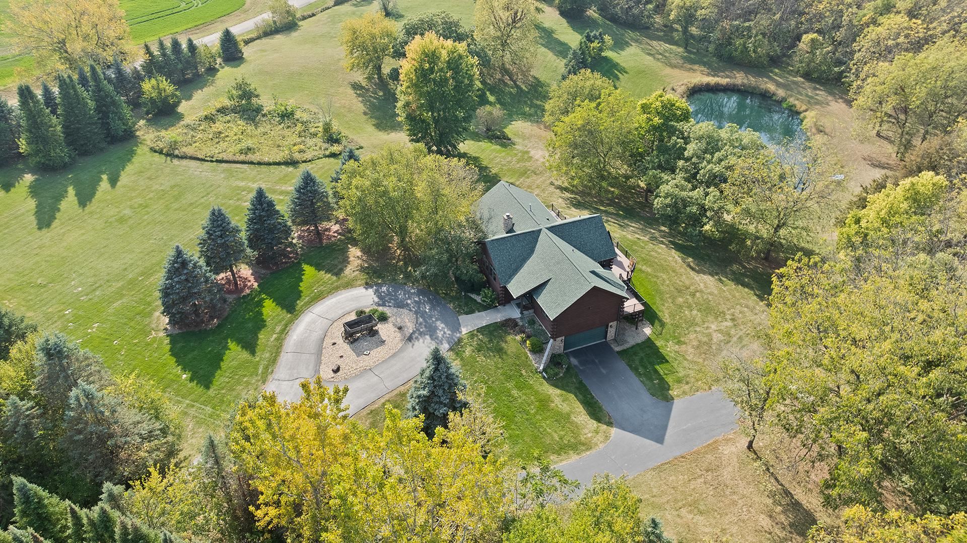 5810 West Lightsville Road Leaf River, IL 61047 - Photo 44 of 68 an aerial view of a house with a yard and lake view