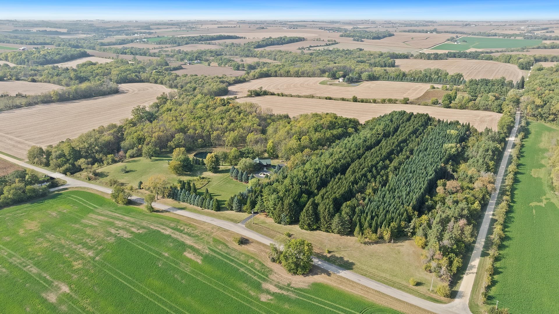 5810 West Lightsville Road Leaf River, IL 61047 - Photo 61 of 68 an aerial view of residential houses with outdoor space and trees