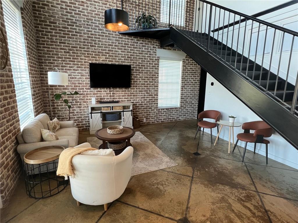 5434 Peachtree Road, Unit 119 Atlanta, GA 30341 - Photo 5 of 44 a living room with furniture a flat screen tv and a fireplace