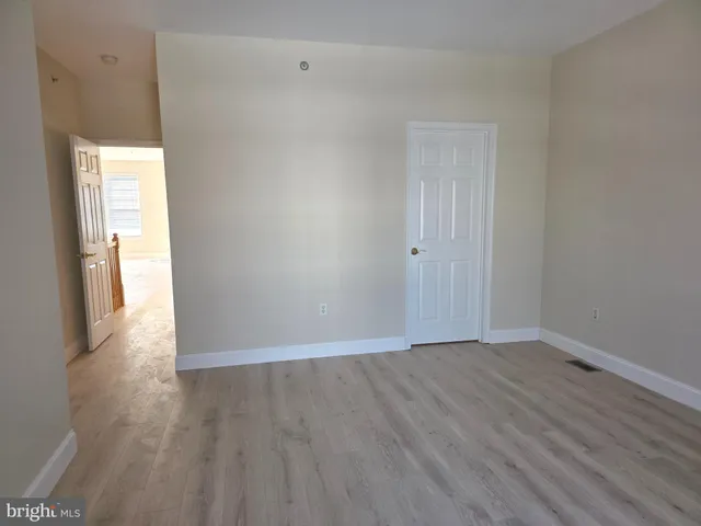 a view of a hallway with a window