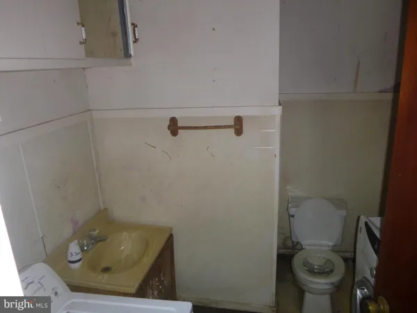 a bathroom with a toilet and a sink
