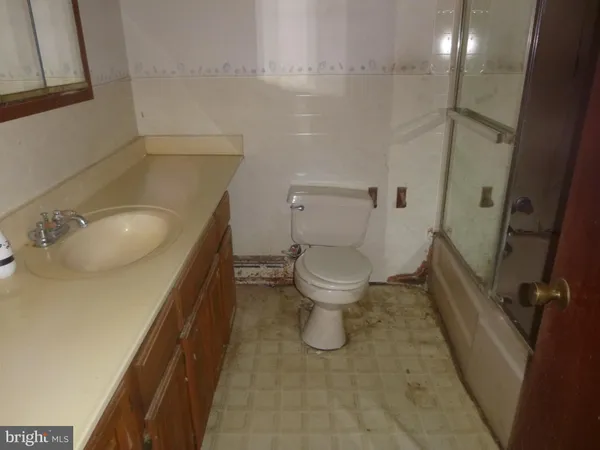 a bathroom with a sink and toilet