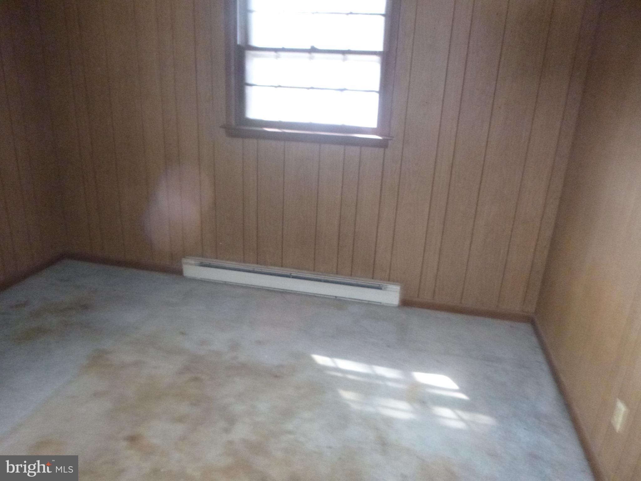 4159 Jacksonville Road Crisfield, MD 21817 - Photo 8 of 12 a view of an empty room with a window