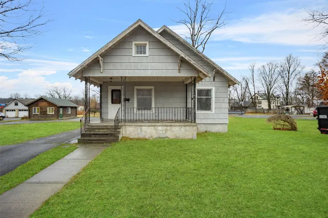 a front view of a house with a yard