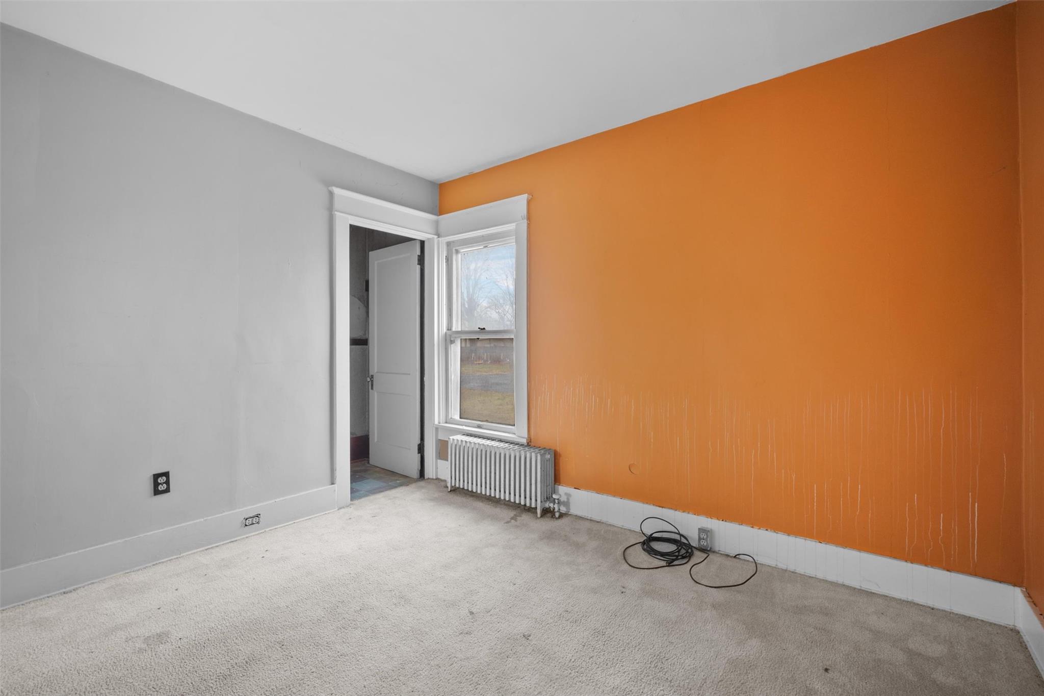 79 Maple Avenue Catskill, NY 12414 - Photo 13 of 35 Empty room featuring light colored carpet and radiator