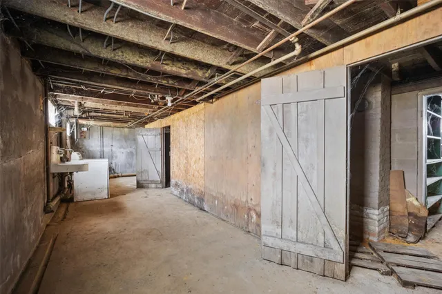 a view of an empty room with a fireplace