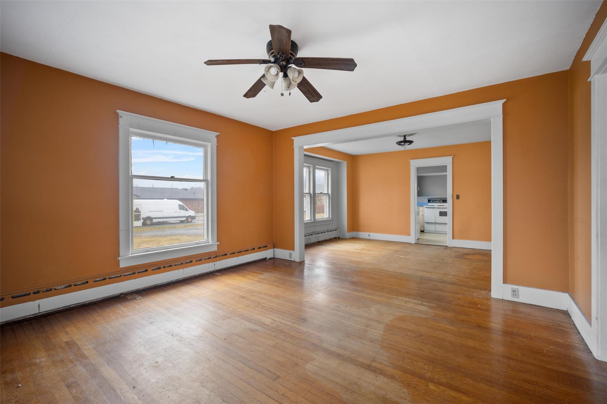79 Maple Avenue Catskill, NY 12414 - Photo 5 of 35 Spare room featuring baseboard heating, ceiling fan, and light hardwood / wood-style flooring