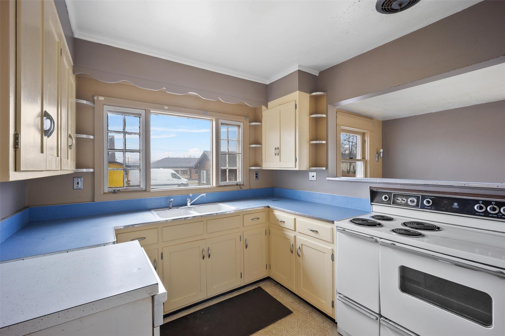79 Maple Avenue Catskill, NY 12414 - Photo 8 of 35 Kitchen with sink, double oven range, and cream cabinetry