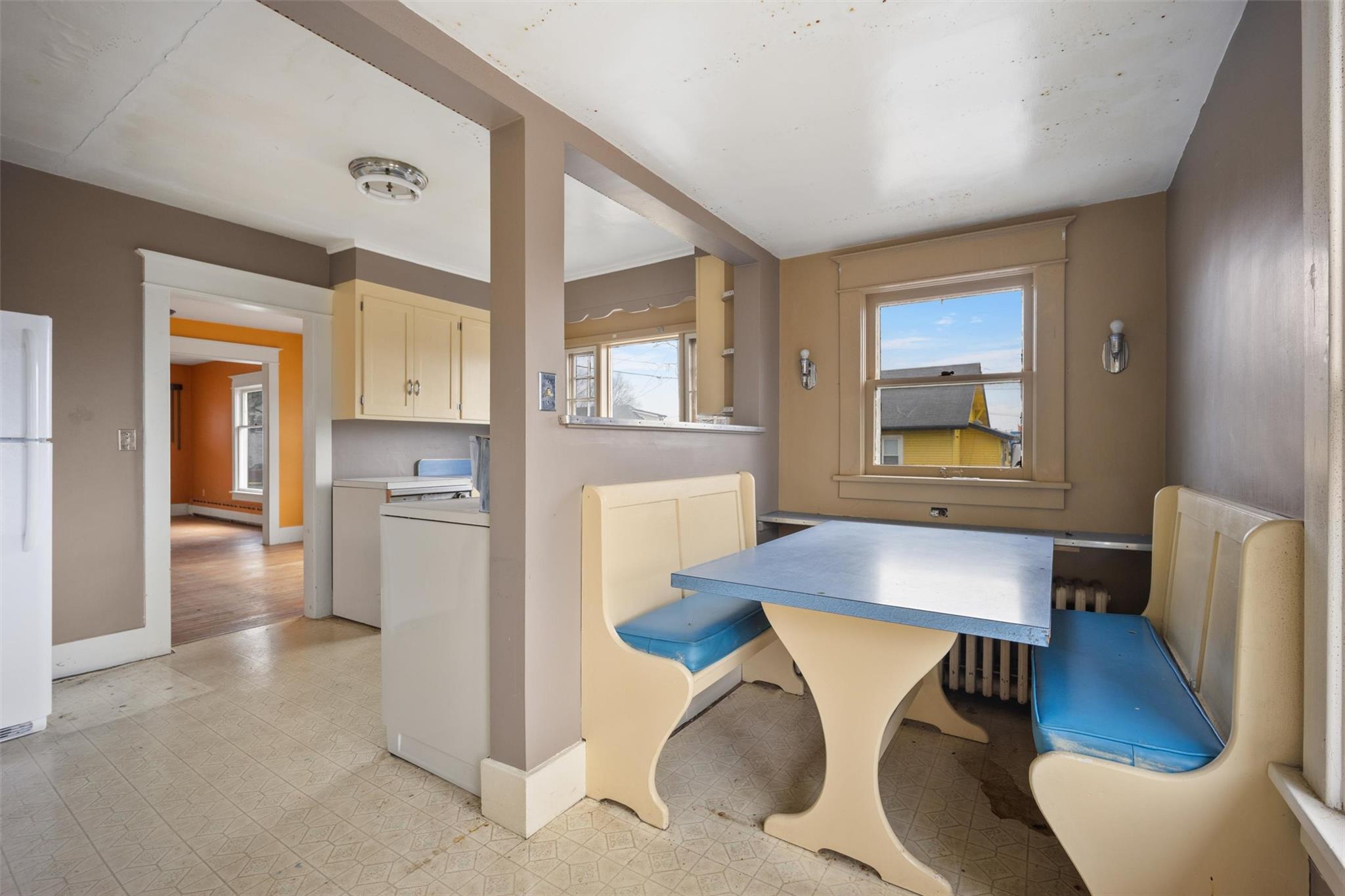 79 Maple Avenue Catskill, NY 12414 - Photo 9 of 35 Dining space featuring independent washer and dryer, a baseboard heating unit, and a healthy amount of sunlight