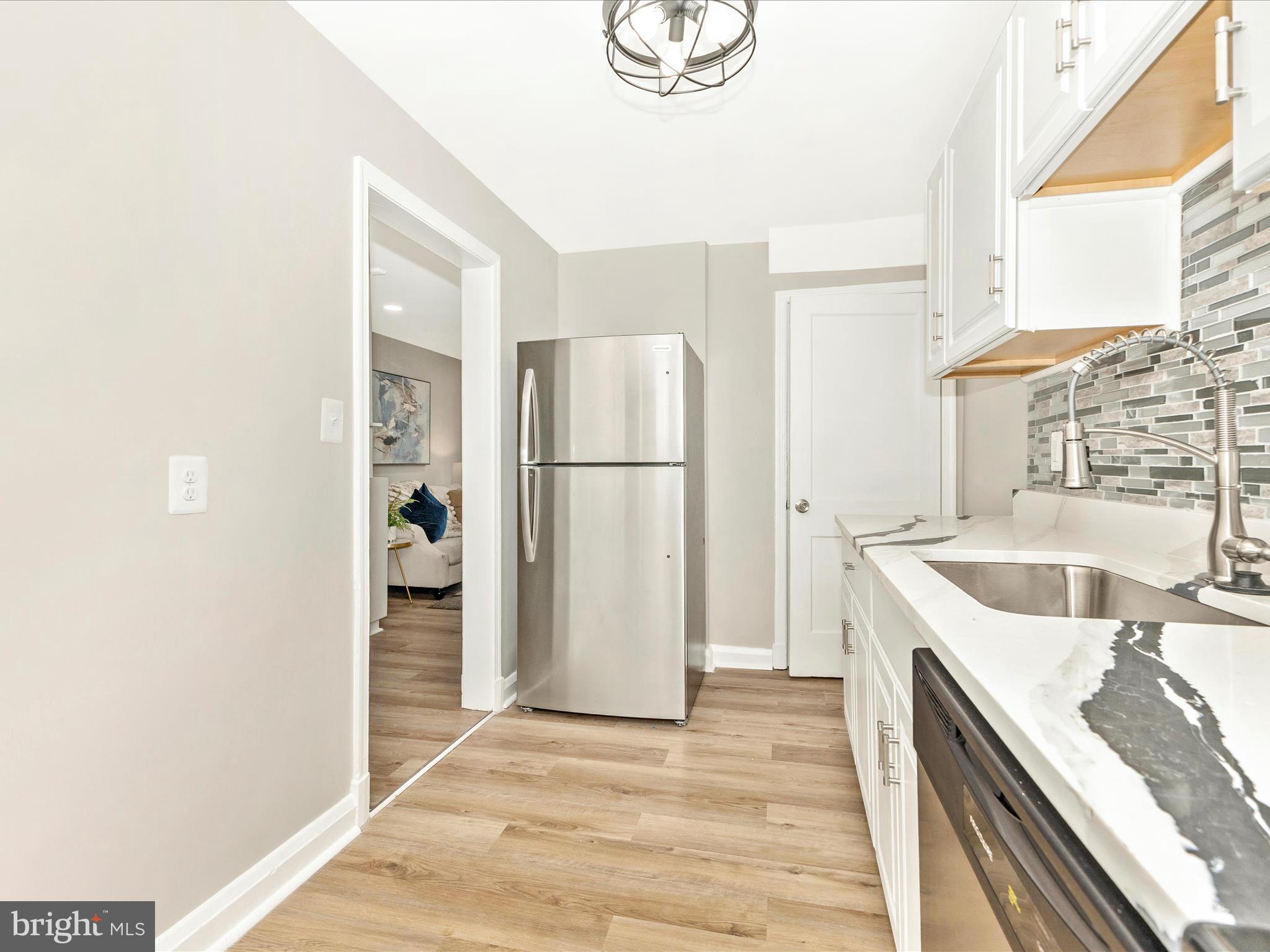 1331 Dalton Road Baltimore, MD 21234 - Photo 14 of 41 a kitchen with a refrigerator and a sink
