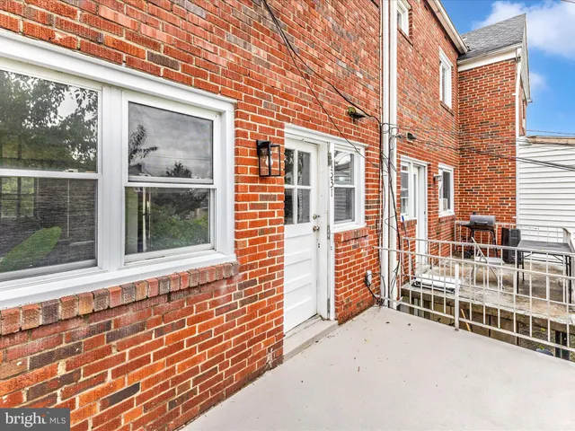 a view of a building with a yard