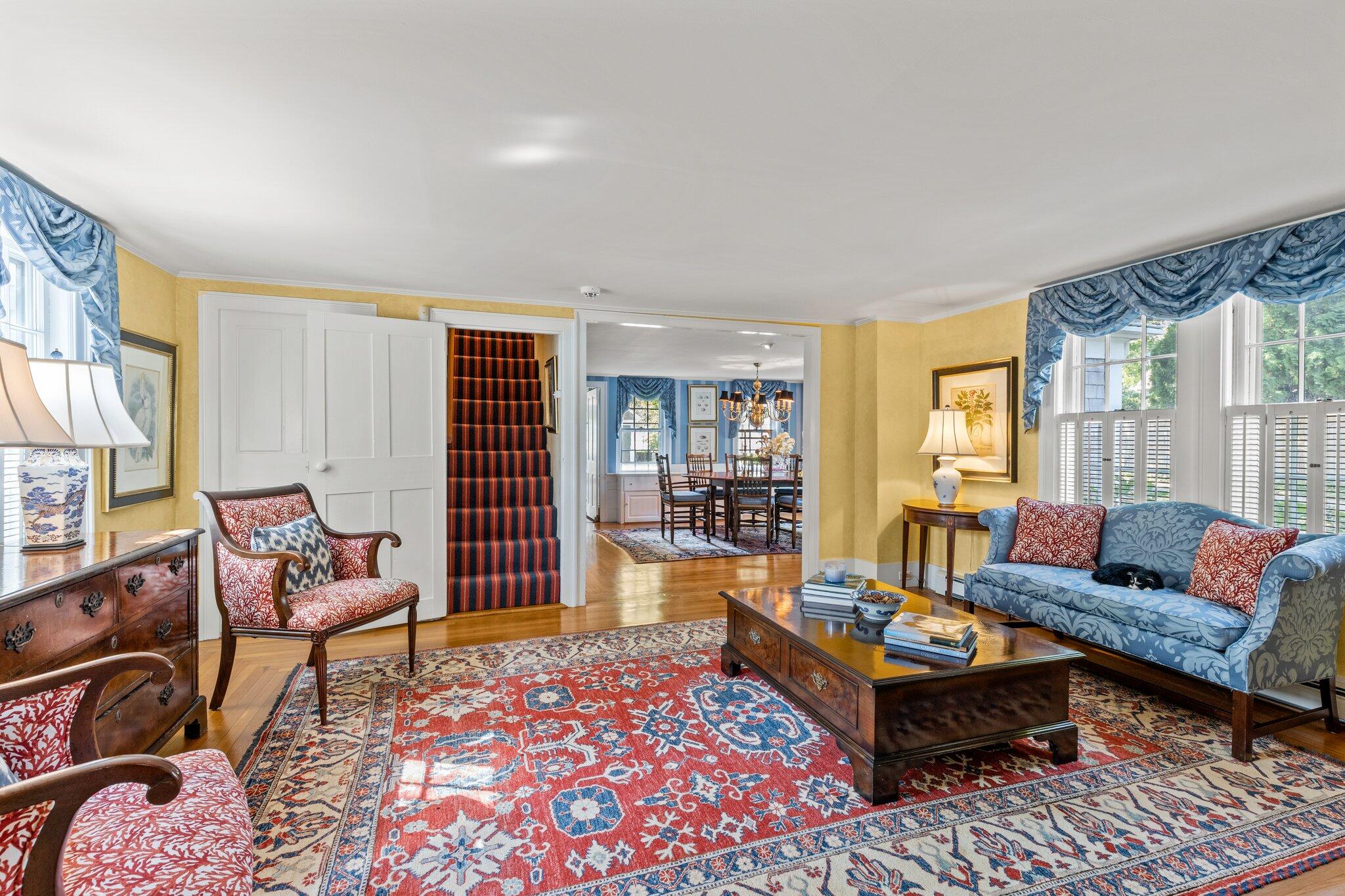 4259 Main Street Barnstable, MA 02630 - Photo 12 of 69 a living room with furniture and a rug