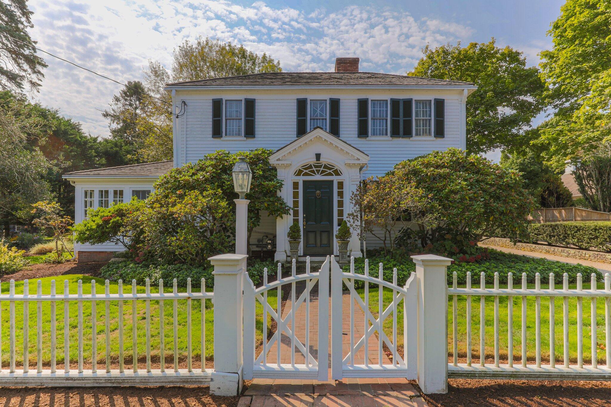 4259 Main Street Barnstable, MA 02630 - Photo 2 of 69 a front view of a house with a garden and plants