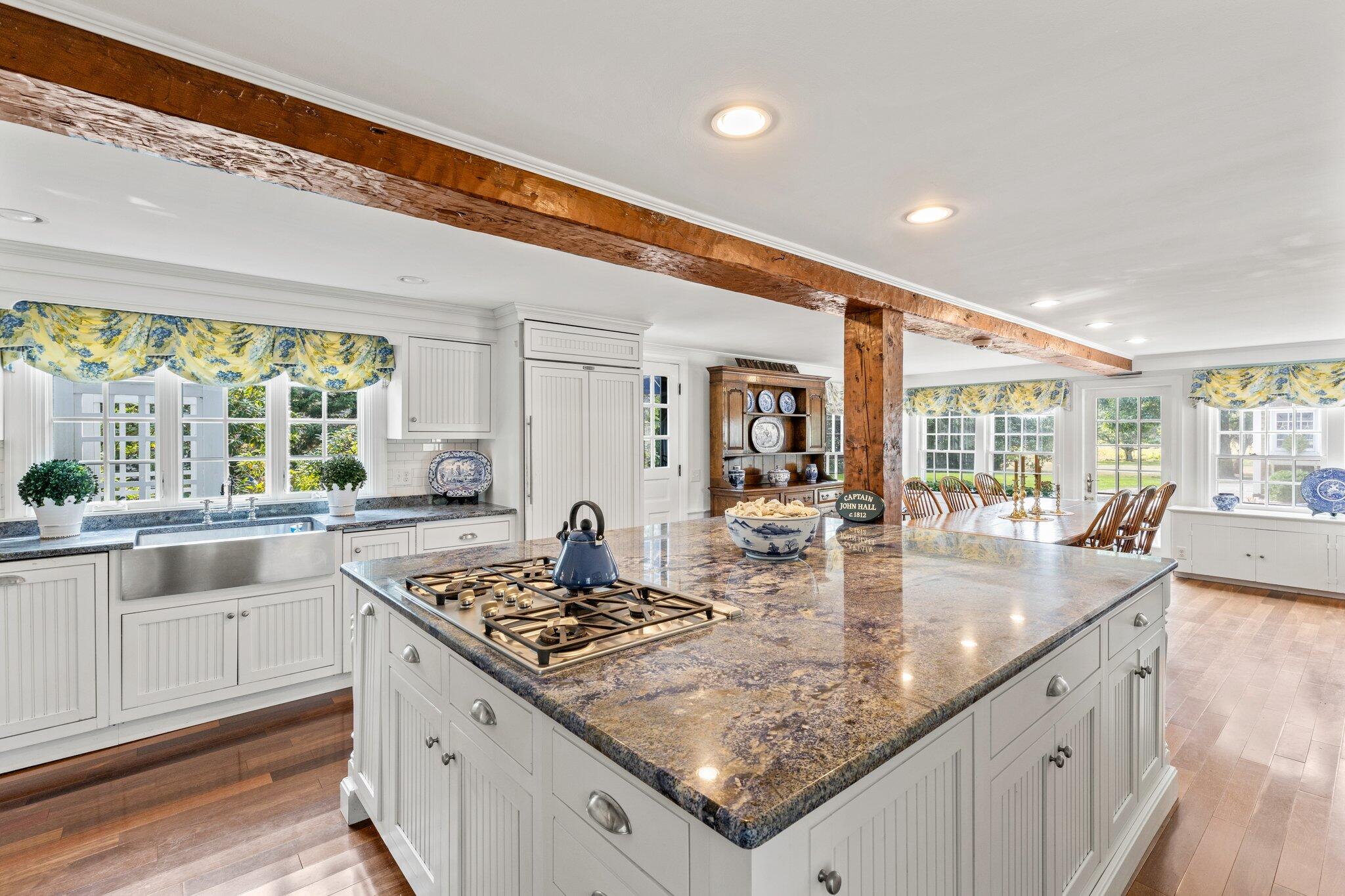 4259 Main Street Barnstable, MA 02630 - Photo 22 of 69 a kitchen with granite countertop a sink and cabinets