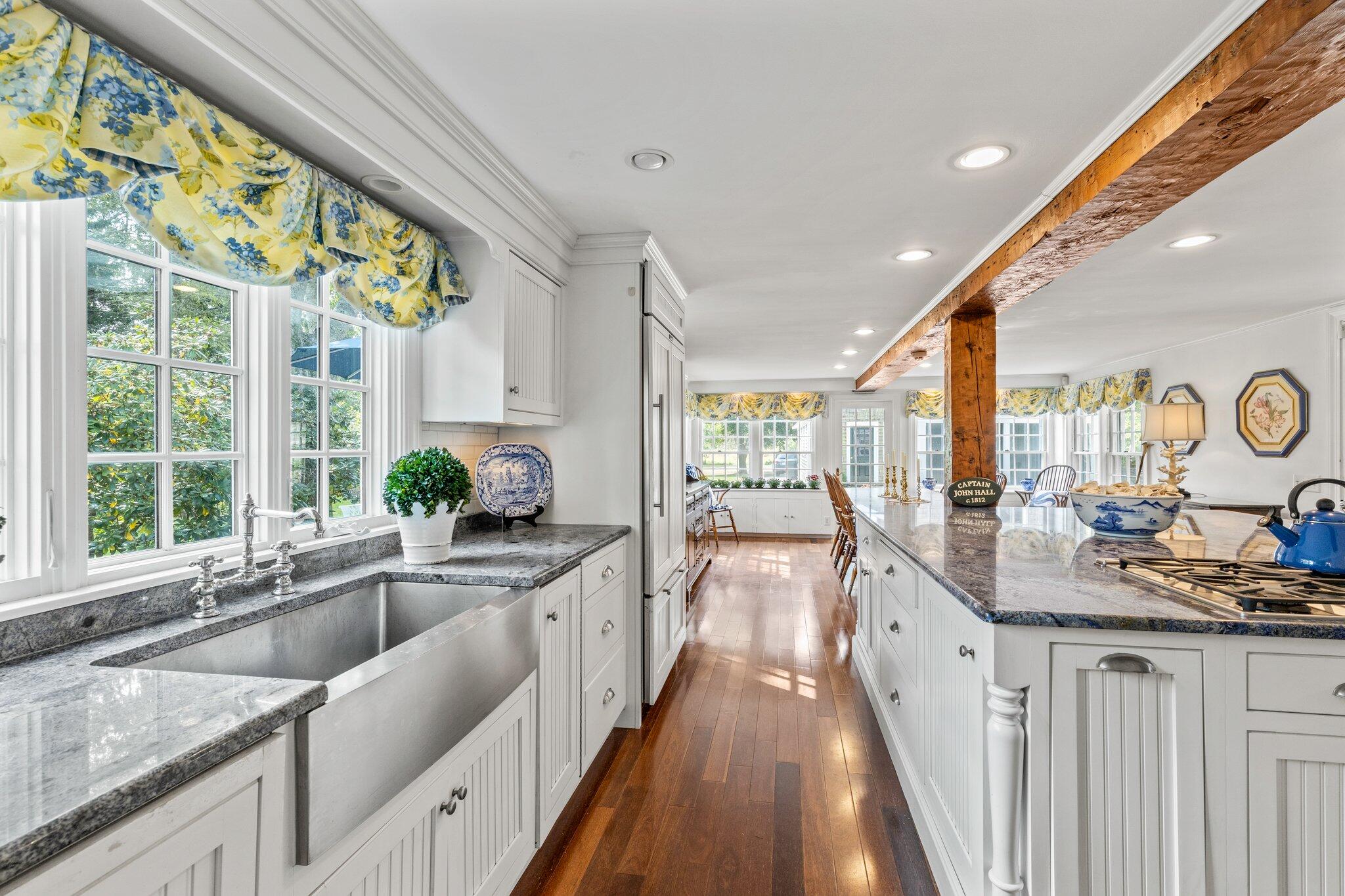 4259 Main Street Barnstable, MA 02630 - Photo 25 of 69 a kitchen with granite countertop a sink stove and cabinets