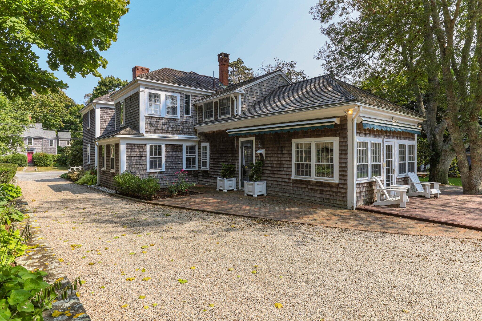 4259 Main Street Barnstable, MA 02630 - Photo 3 of 69 a front view of a house with a garden