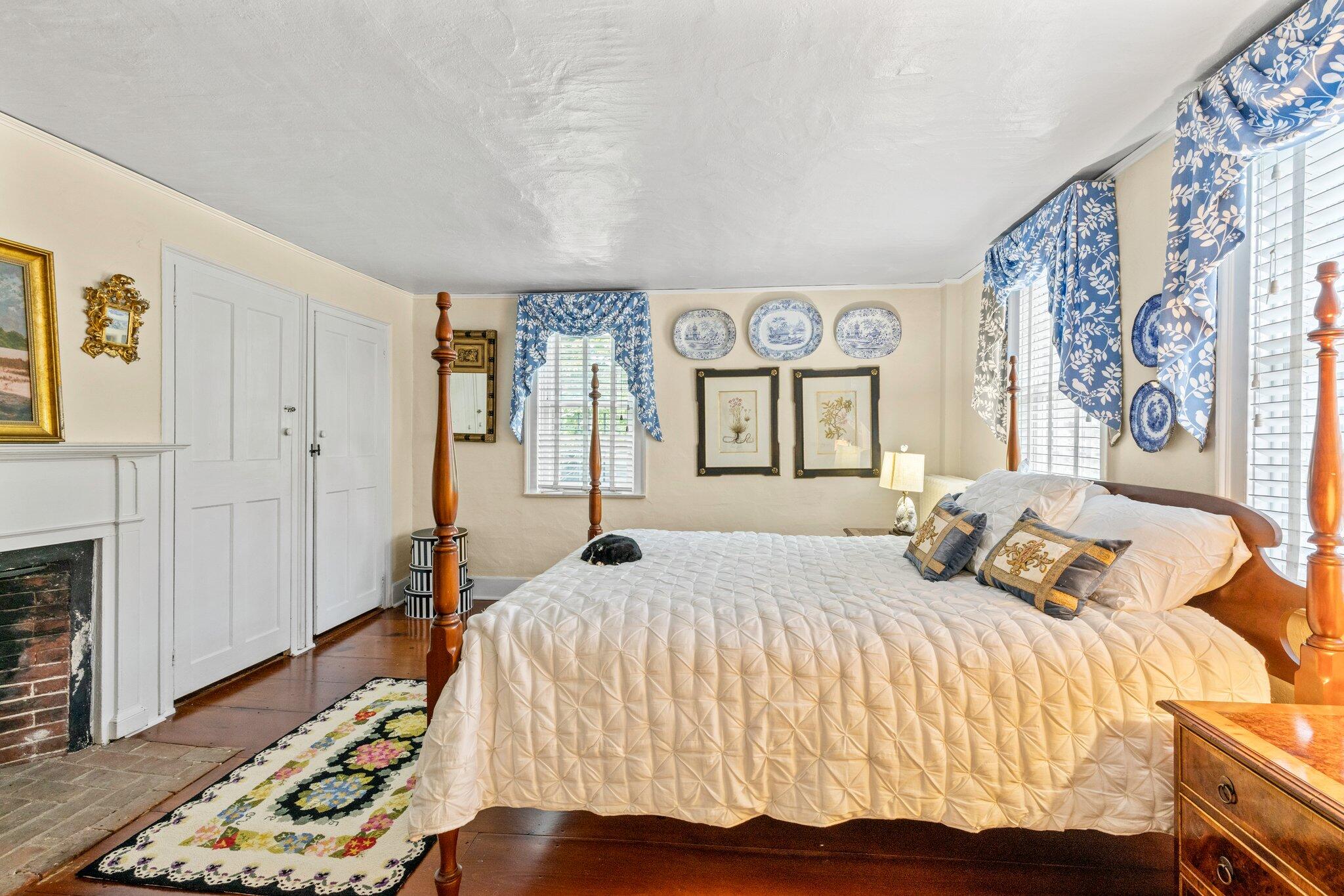 4259 Main Street Barnstable, MA 02630 - Photo 33 of 69 a bedroom with a bed and wooden floor