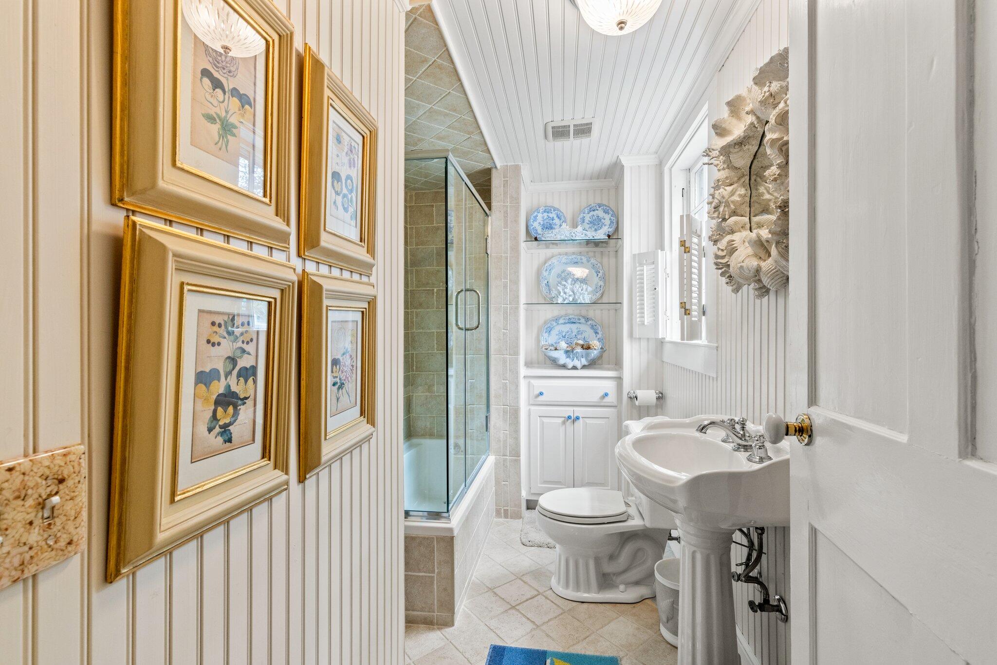 4259 Main Street Barnstable, MA 02630 - Photo 34 of 69 a bathroom with a toilet a sink and a large mirror