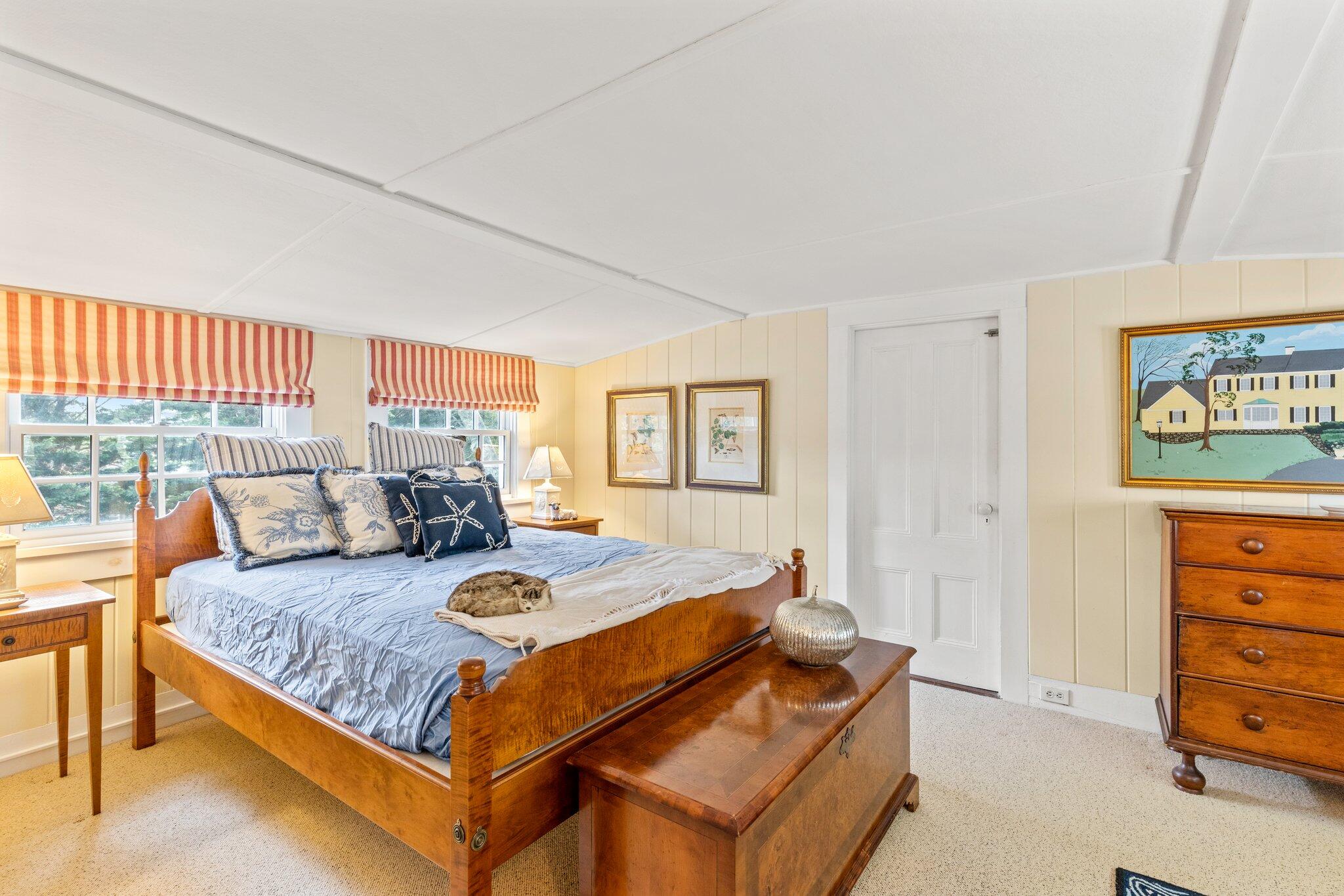 4259 Main Street Barnstable, MA 02630 - Photo 41 of 69 a bedroom with a bed and a dresser