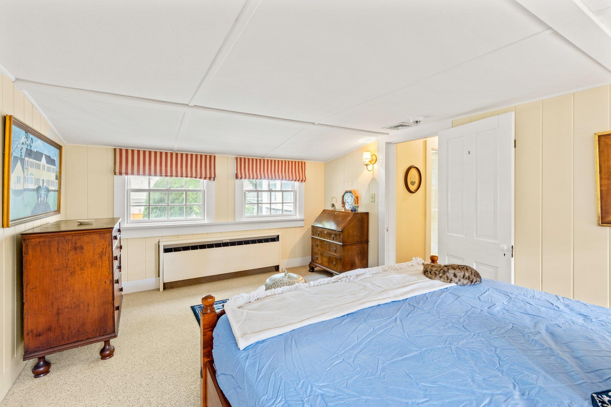 4259 Main Street Barnstable, MA 02630 - Photo 42 of 69 a bedroom with a bed and large windows