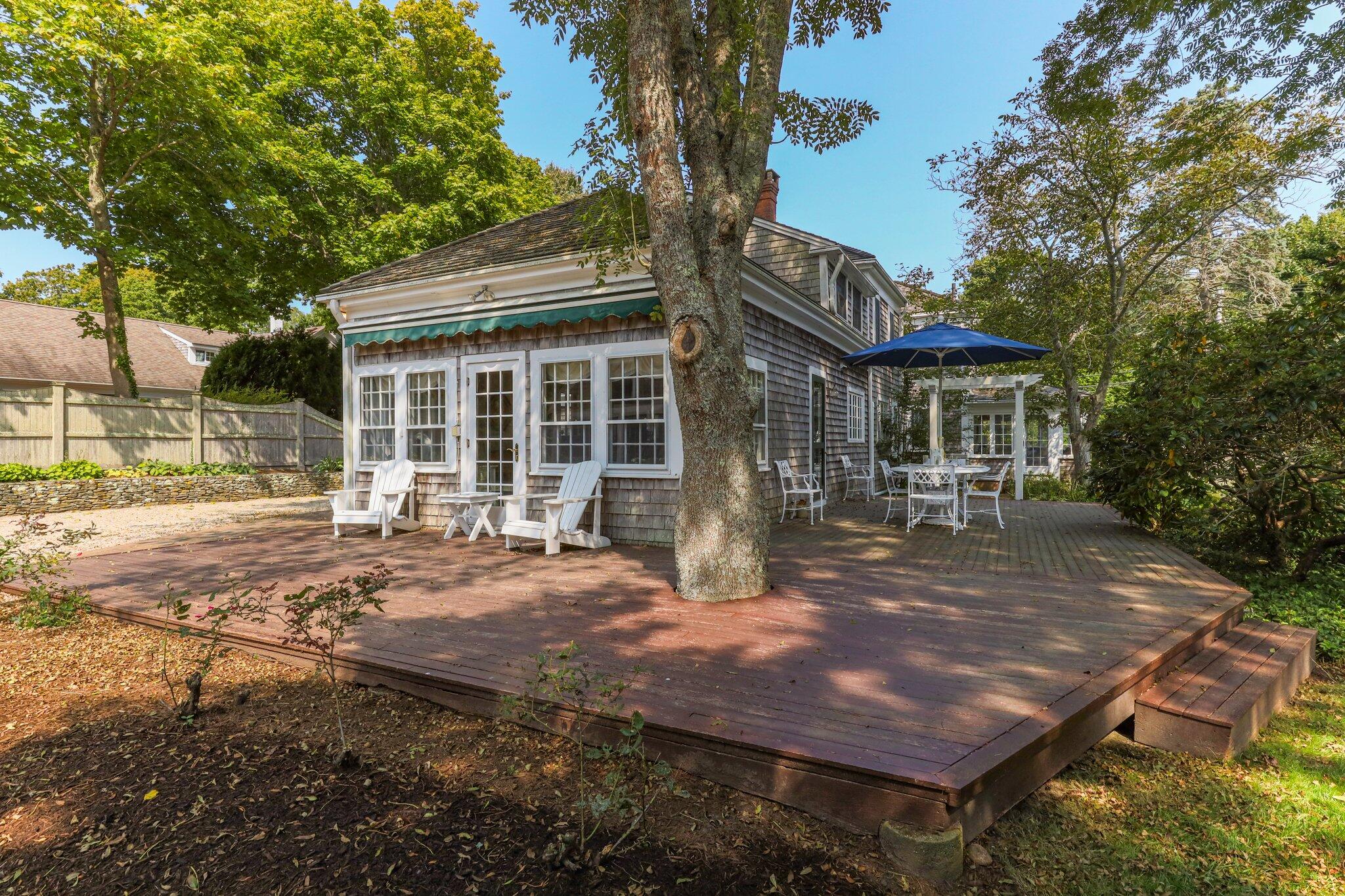 4259 Main Street Barnstable, MA 02630 - Photo 48 of 69 a view of a house with backyard porch and sitting area