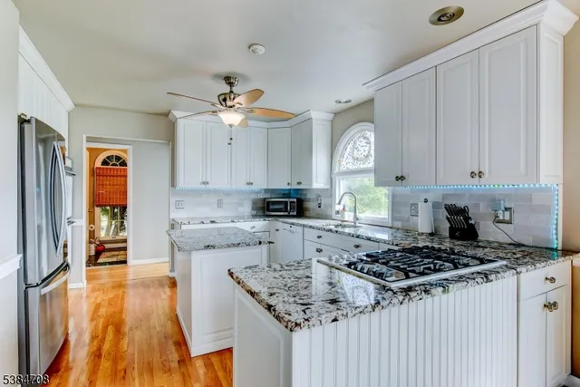 a kitchen with a stove a sink and a refrigerator