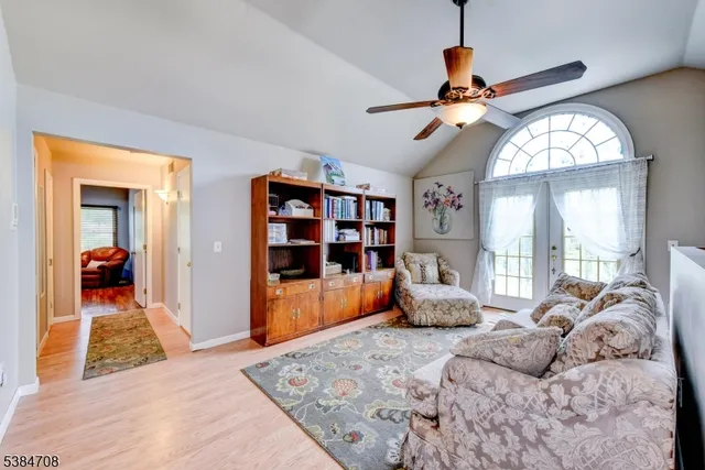 a bedroom with furniture and a chandelier