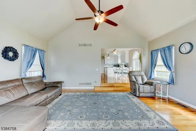 a view of a livingroom with furniture and a rug