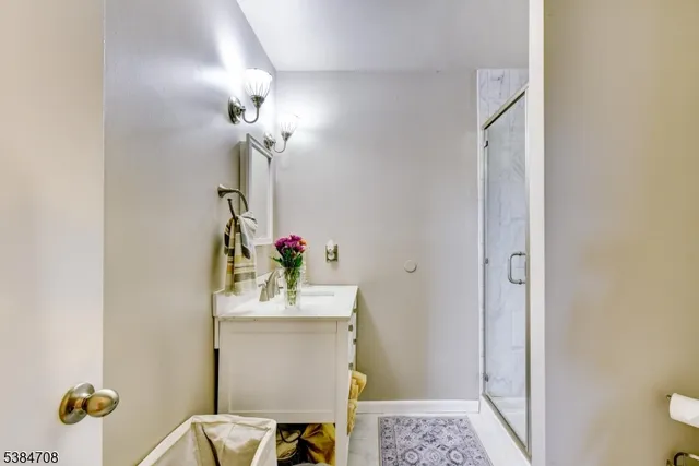 a bathroom with a sink and mirror