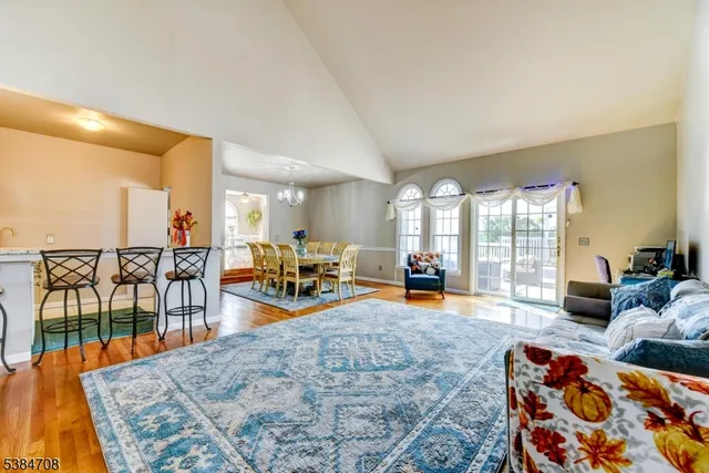 a living room filled with furniture and a large window