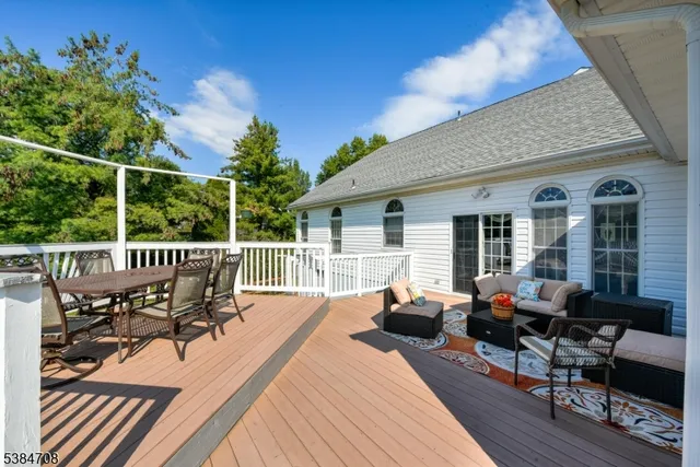 a view of roof deck with furniture