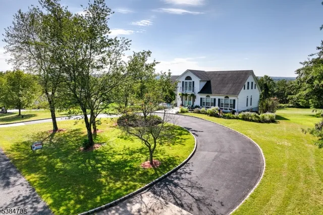 a view of house that has a yard