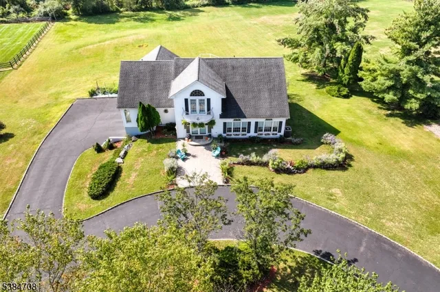a house with swimming pool in front of it