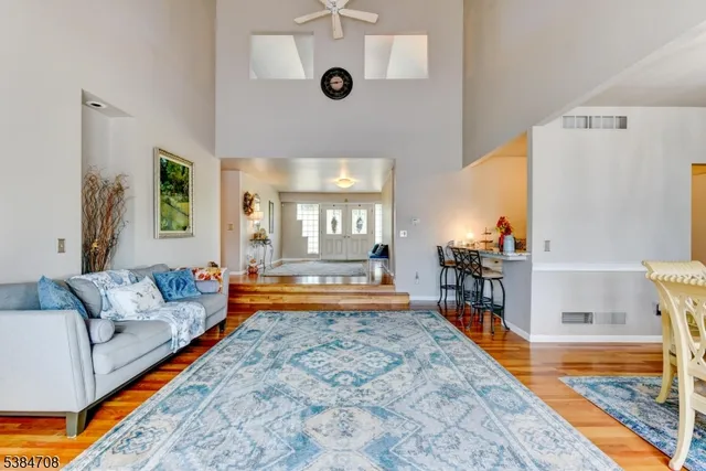 a living room with furniture and a rug