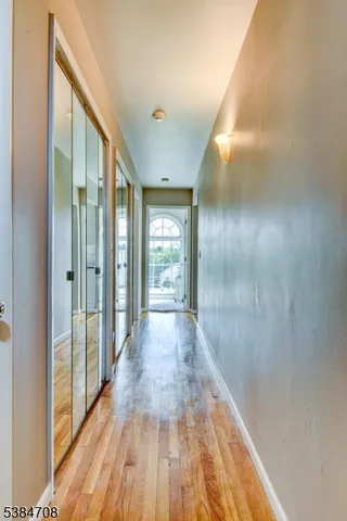 a view of gallery with wooden floor