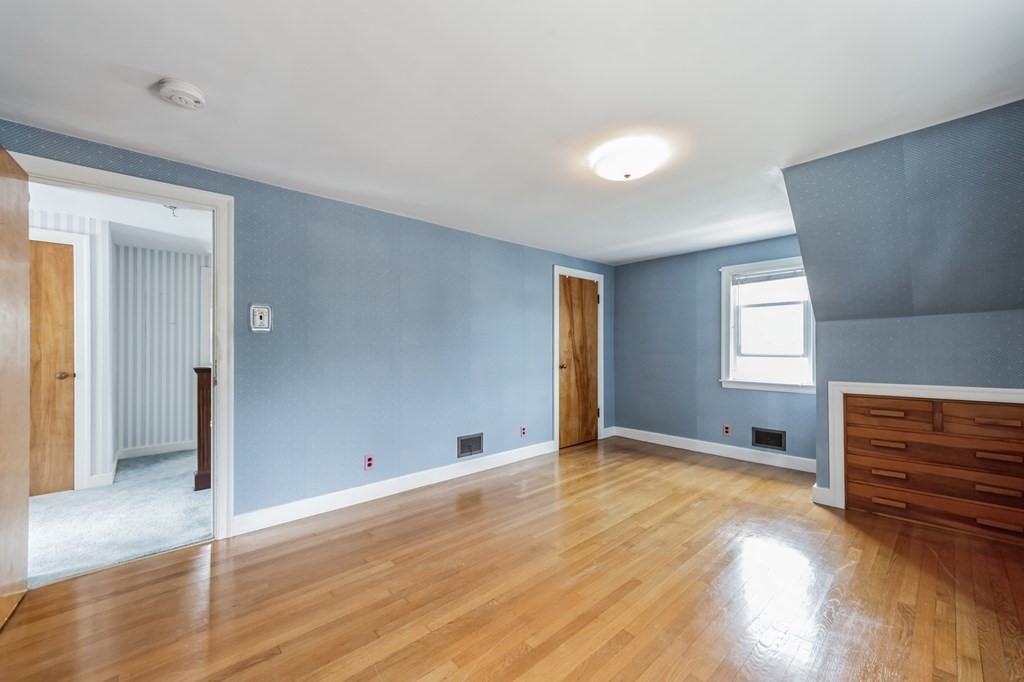 90 Lexington Road Billerica, MA 01821 - Photo 19 of 28 wooden floor in an empty room with a window