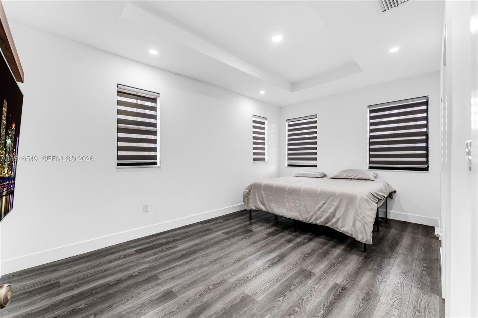 23601 Southwest 112 Court Homestead, FL 33032 - Photo 12 of 61 a bedroom with a bed and a window