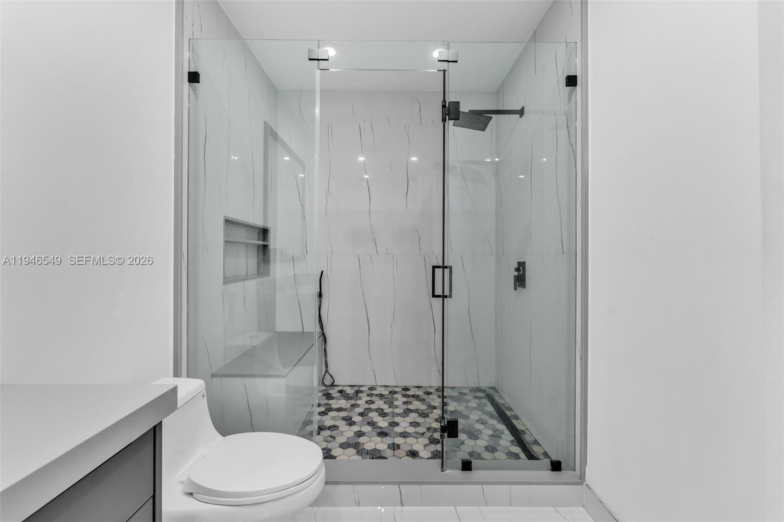 23601 Southwest 112 Court Homestead, FL 33032 - Photo 17 of 61 a bathroom with a glass shower door