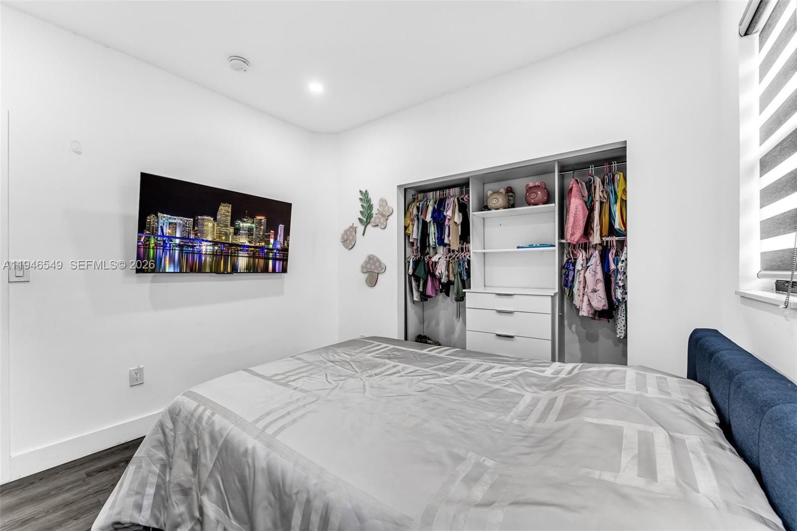 23601 Southwest 112 Court Homestead, FL 33032 - Photo 19 of 61 a bedroom with a bed and a window