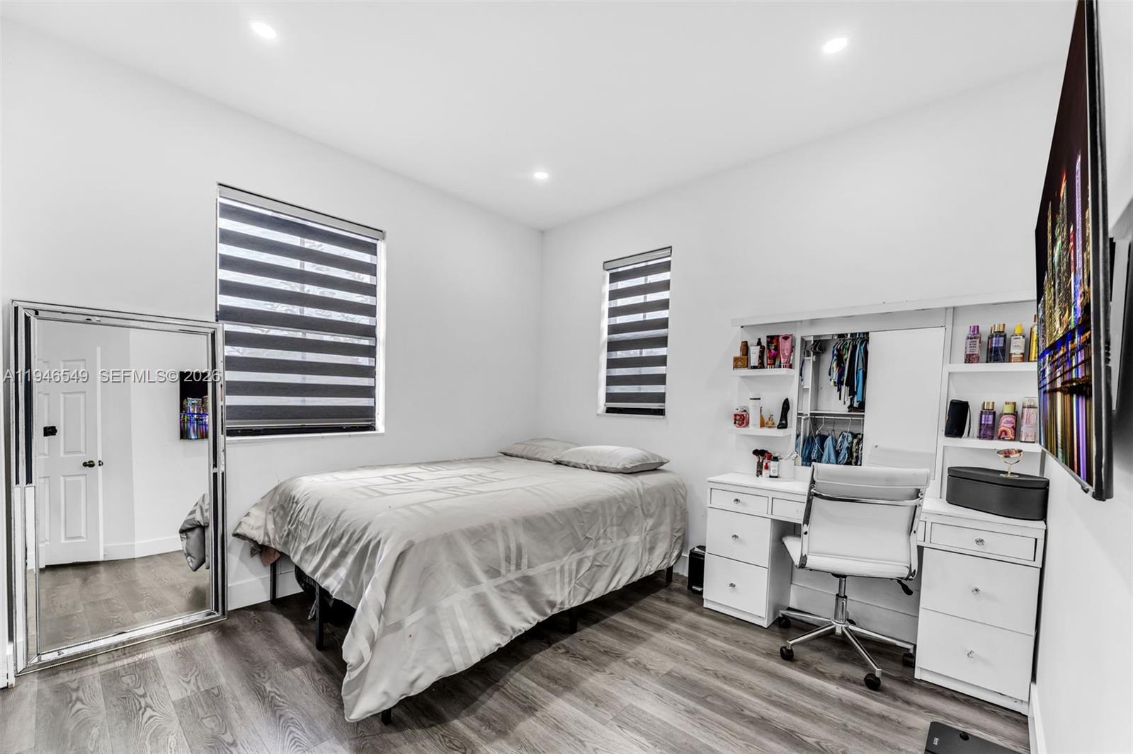 23601 Southwest 112 Court Homestead, FL 33032 - Photo 22 of 61 a bedroom with a bed and a desk