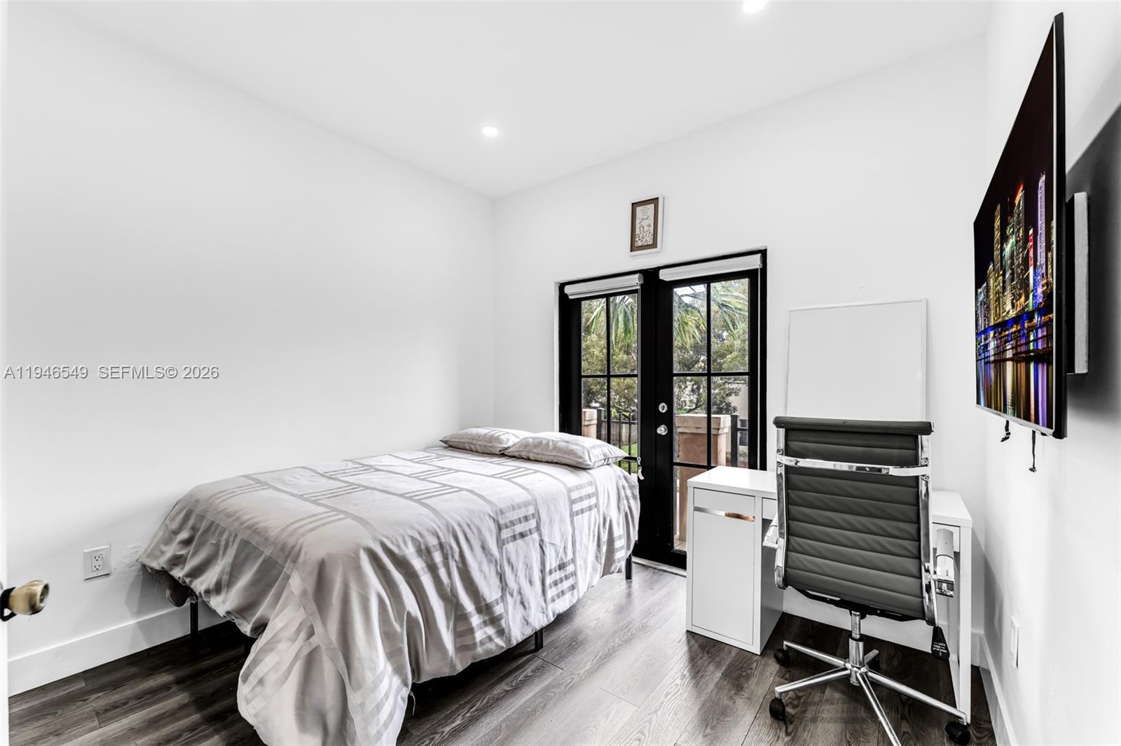 23601 Southwest 112 Court Homestead, FL 33032 - Photo 24 of 61 a bedroom with a bed and wooden floor