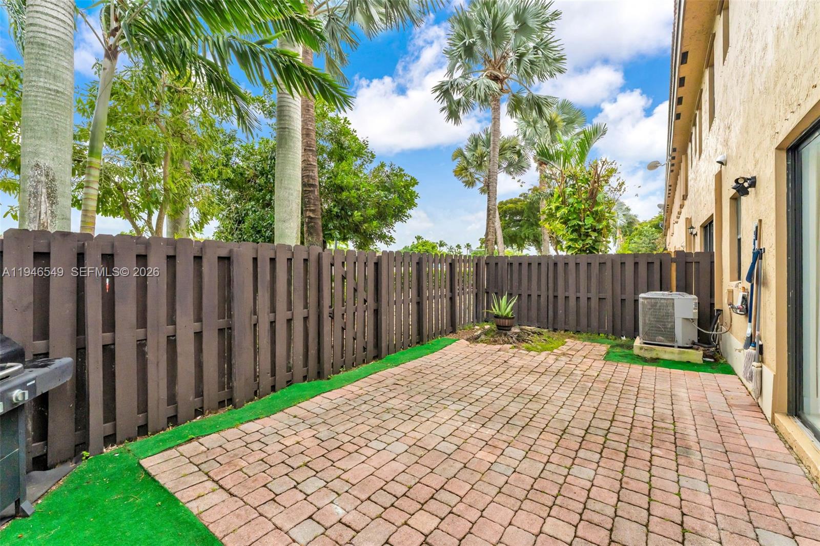 23601 Southwest 112 Court Homestead, FL 33032 - Photo 27 of 61 a backyard of a house with table and chairs