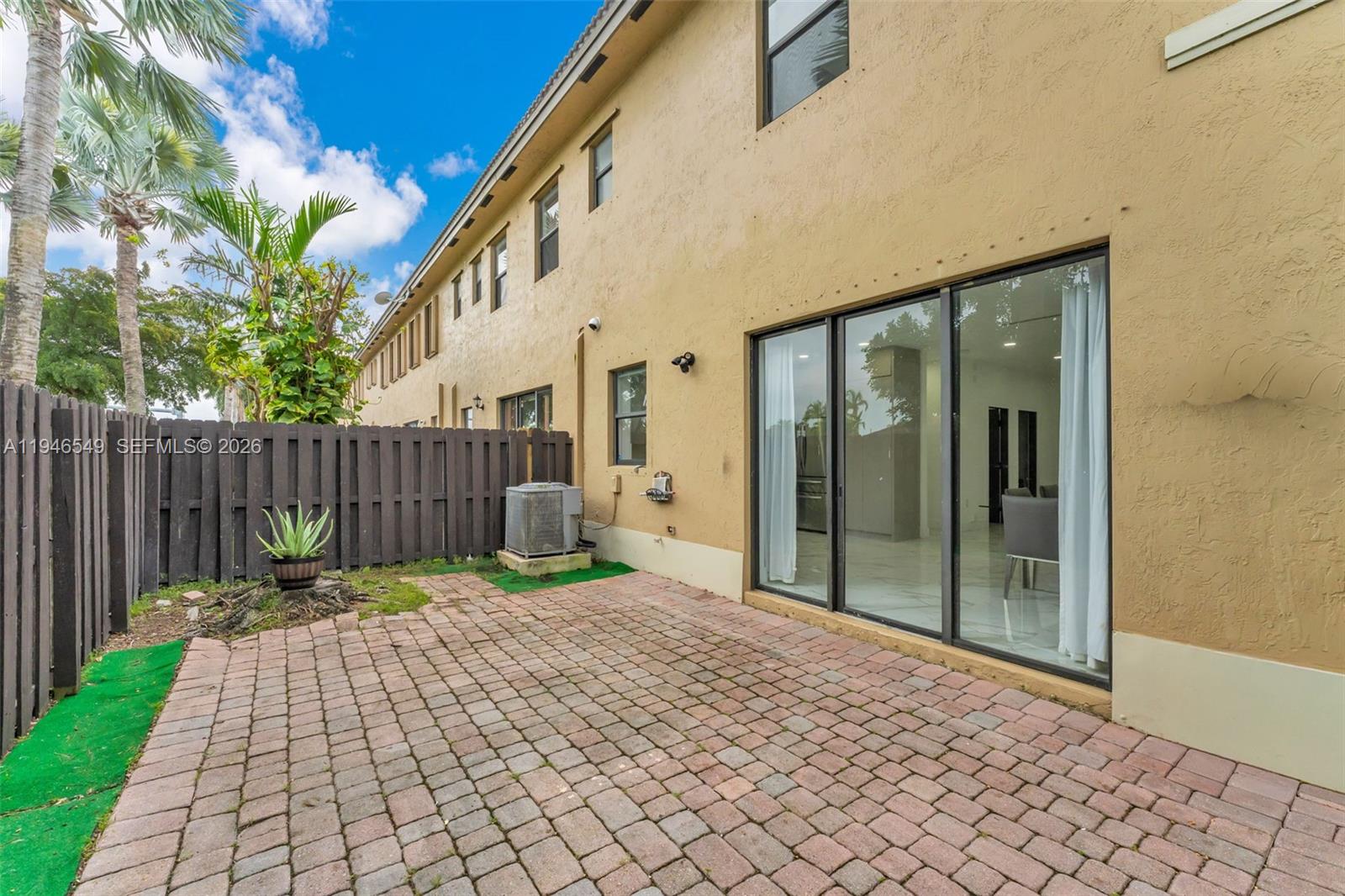 23601 Southwest 112 Court Homestead, FL 33032 - Photo 28 of 61 a backyard of a house with wooden fence
