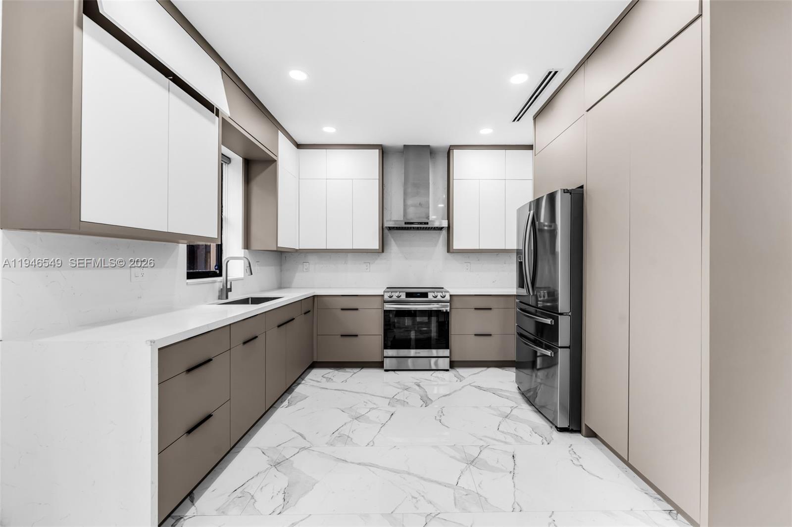 23601 Southwest 112 Court Homestead, FL 33032 - Photo 5 of 61 a kitchen with a refrigerator sink stove and cabinets