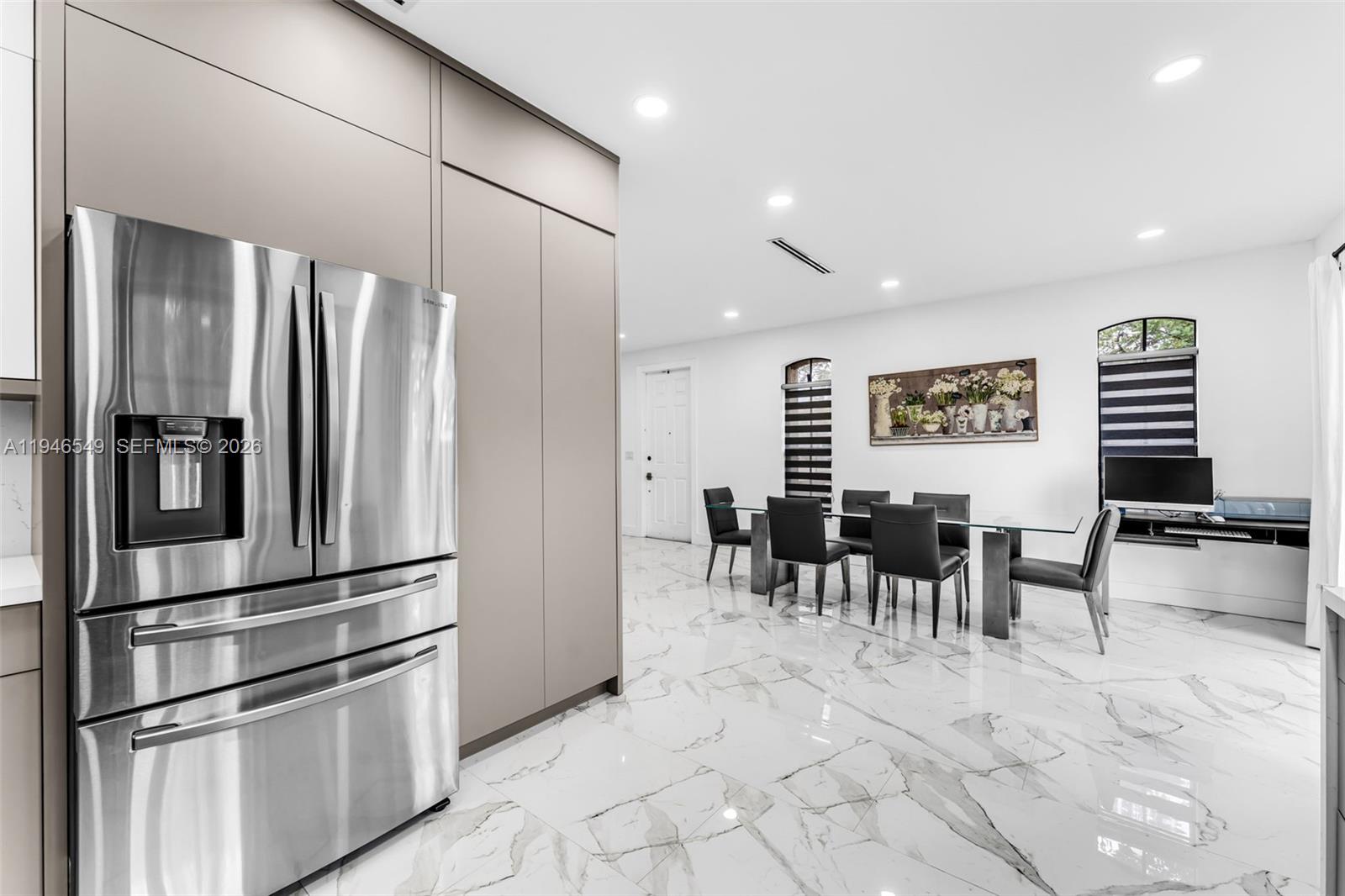 23601 Southwest 112 Court Homestead, FL 33032 - Photo 6 of 61 a kitchen with lots of counter space and stainless steel appliances