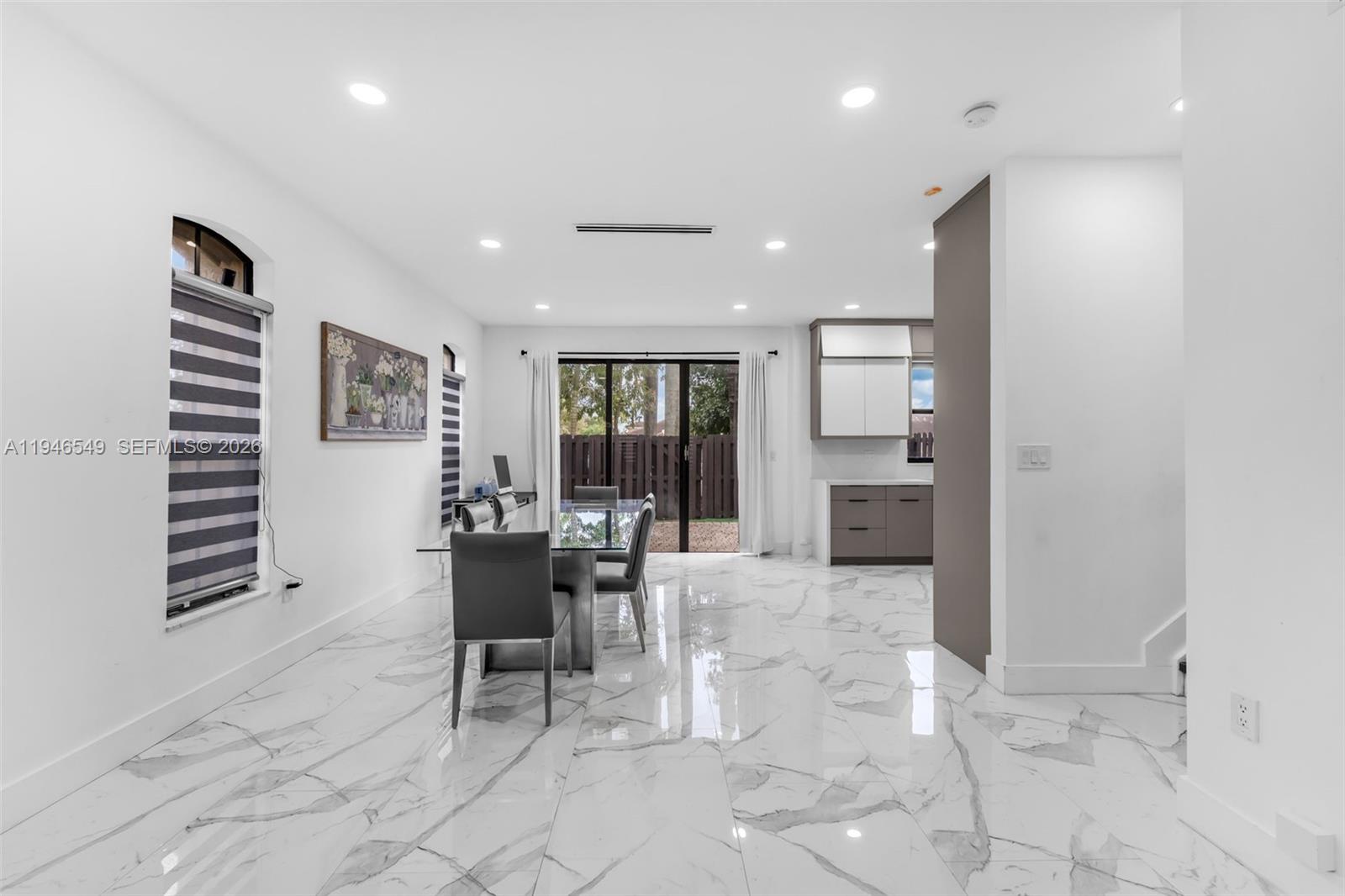 23601 Southwest 112 Court Homestead, FL 33032 - Photo 7 of 61 a dining room with furniture and view kitchen
