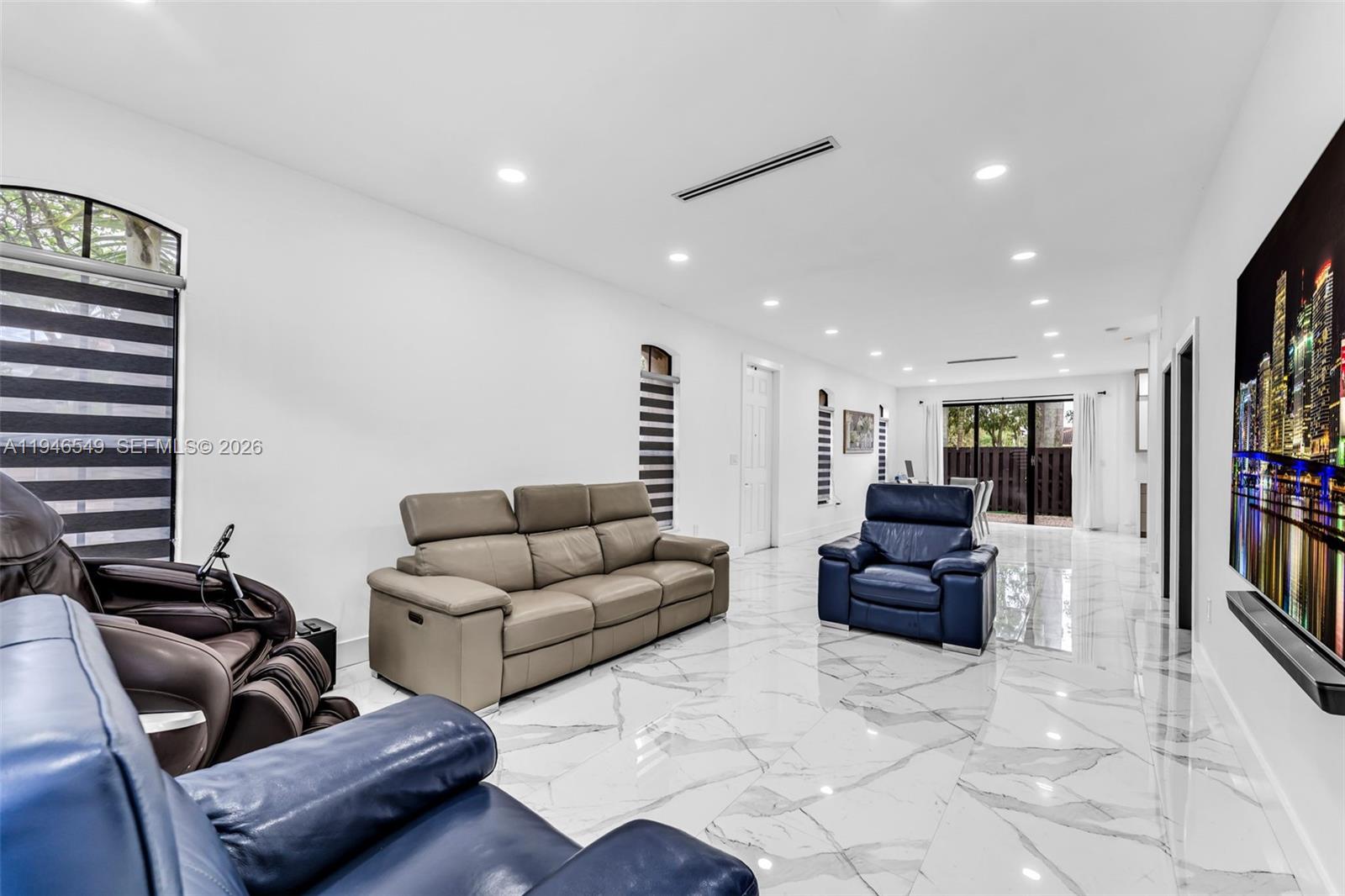 23601 Southwest 112 Court Homestead, FL 33032 - Photo 9 of 61 a living room with furniture and a flat screen tv