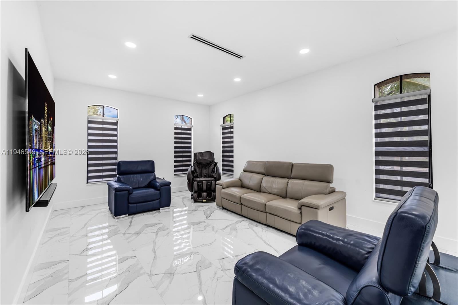 23601 Southwest 112 Court Homestead, FL 33032 - Photo 10 of 61 a living room with furniture and a flat screen tv
