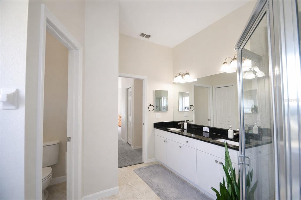2009 Meadow Rue Court Trinity, FL 34655 - Photo 7 of 21 a kitchen with a refrigerator and a sink