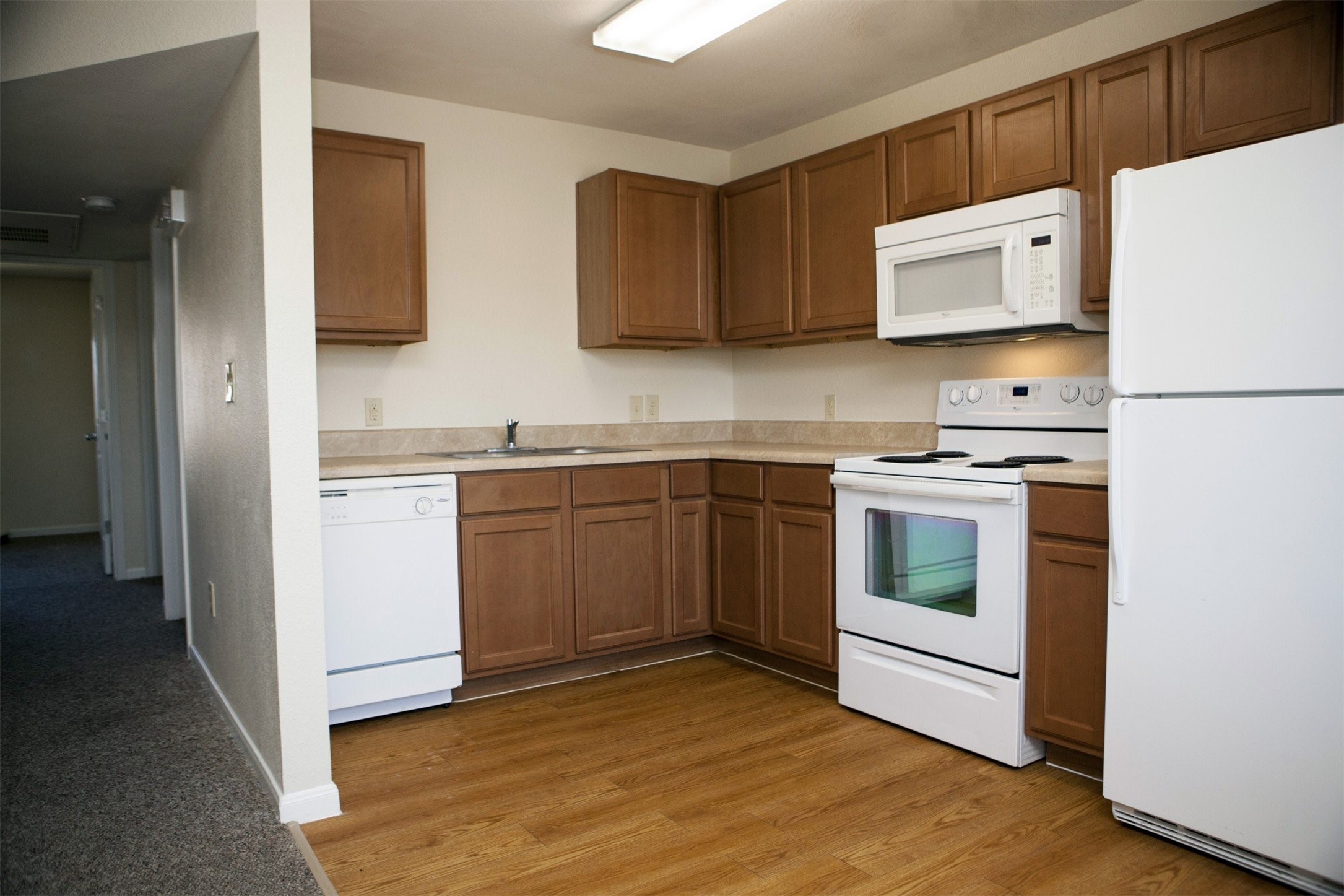 1215 Castroville Road San Antonio, TX 78237 - Photo 12 of 14 a kitchen with a sink cabinets and appliances